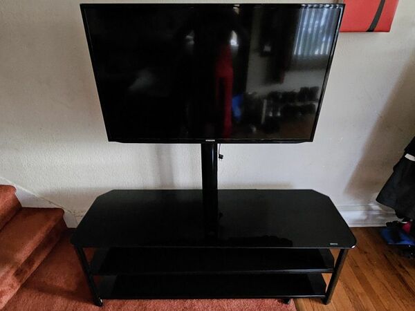 42" Samsung LCD TV w/ Black Innovex stand.