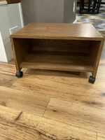 Wooden stand on wheels with storage