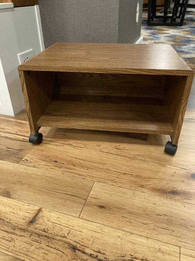 Wooden stand on wheels with storage