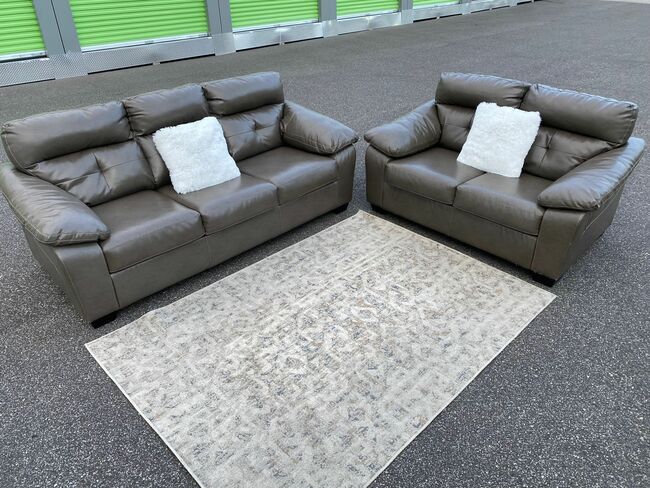 FREE DELIVERY AND INSTALLATION - Ashley Furniture - Gray Leather Color Sofa And Love Seat