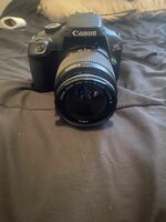 Canon Camera With Tripod