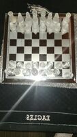 THIS ABSOLUTELY STUNNING POLISHED GLASS CHESS SET.