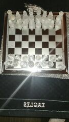 THIS ABSOLUTELY STUNNING POLISHED GLASS CHESS SET.