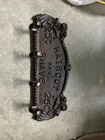 CAST IRON HAIR CUT AND SHAVE 25 CENTS BATHROOM HANGER  SIGN 13" LONG VG CONDITIO