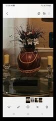 Centerpiece ceramic Table vase and the flowers And two glass Candleholders With candles