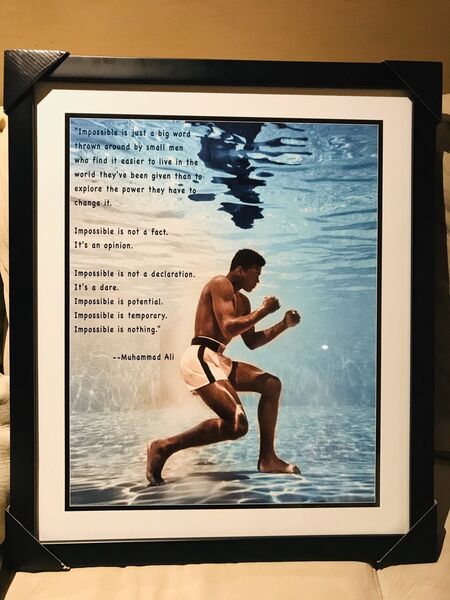 Ali training under water with quote framed ready to hang size 20x24